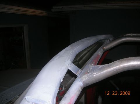 1985 Ford Bronco - Custom roll cage fabrication is underway, with metal tubing being joined and body filler applied.