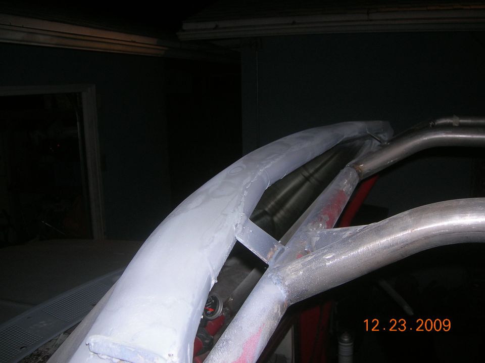 roll cage being welded and smoothed inside a vehicle