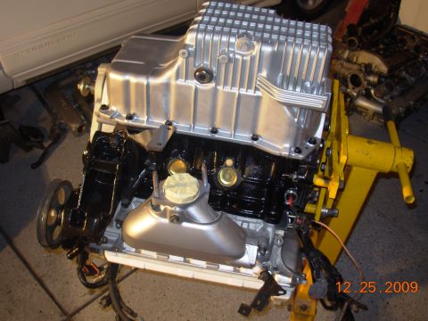 1991 Ford Taurus - Engine assembly on a stand, with a date stamp of 12.25.2009 and SuperMotors.net watermark.