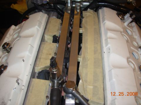 1991 Ford Taurus - Engine components are visible during a repair process, with masking tape protecting parts of the engine.