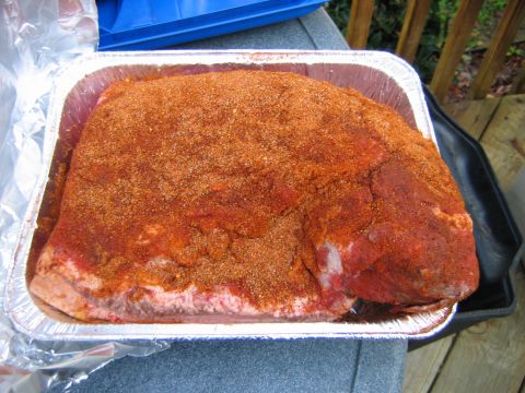1992 Ford Bronco - Meat seasoned with a spice rub in an aluminum pan, with SUPERMOTORS.NET visible.