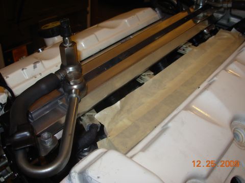 1991 Ford Taurus - Close-up view of engine components, including fuel lines and masking tape, with a date stamp of 12.25.2009.