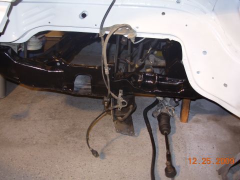 1991 Ford Taurus - Close-up view of the front subframe and steering rack, likely during a restoration or build process.