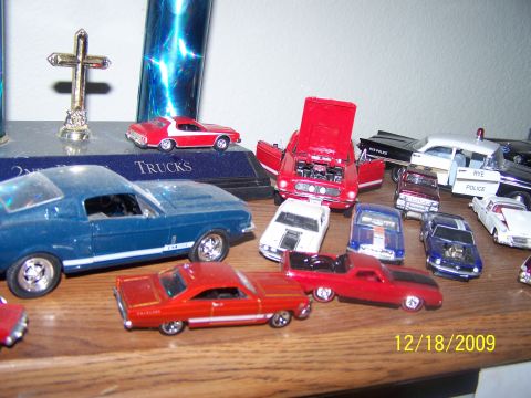 1972 Ford Ranchero - A collection of various model cars are displayed on a wooden shelf, with a date stamp of 12/18/2009 visible.