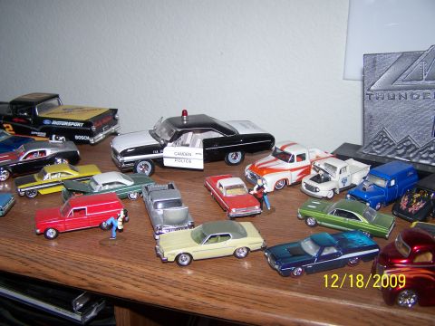 1972 Ford Ranchero - A variety of toy vehicles are displayed on a wooden surface, with a date stamp of 12/18/2009 visible.