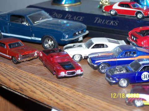 1972 Ford Ranchero - A variety of model cars are displayed on a shelf, with a date stamp visible in the corner.