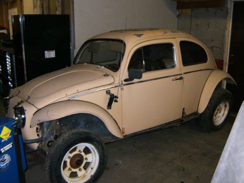 2000 Ford E350 - This modified Volkswagen Beetle has a lifted suspension and larger tires, suggesting it's built for off-road use.
