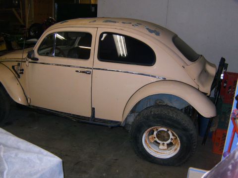 2000 Ford E350 - This tan Volkswagen Beetle appears to be modified for off-road use, larger tires and protective side bars.
