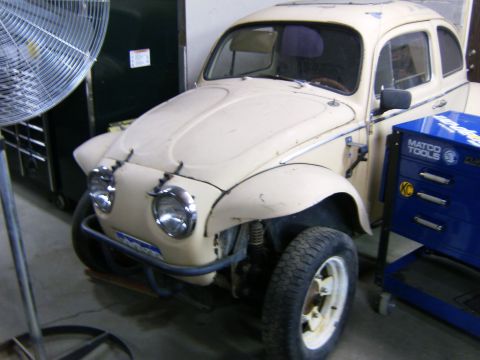 2000 Ford E350 - Modified Volkswagen Beetle in a garage setting next to a toolbox.