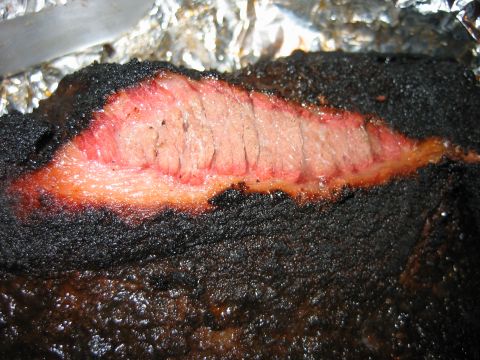 1992 Ford Bronco - Close-up of a smoked brisket showing the texture and color of the meat.
