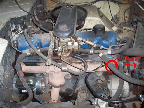 1966 Ford Bronco - Close-up view of a V8 engine bay, focusing on hoses and engine parts. No specific year is identifiable.