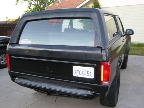 1986 Ford Bronco - Rear view of a black 1986 Ford Bronco, a California license plate.