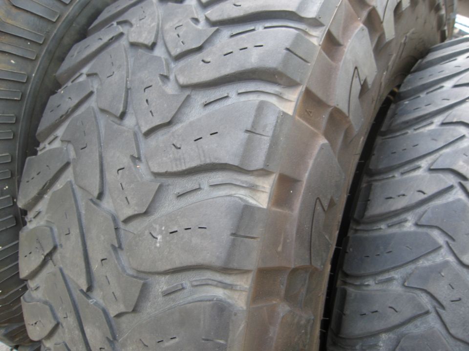 Close-up of aggressive tread pattern on off-road tires