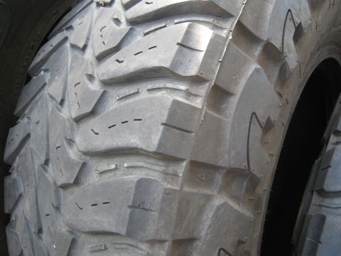 1986 Ford Bronco - The image shows a detailed view of an aggressive tire tread, not a 1986 Ford Bronco.