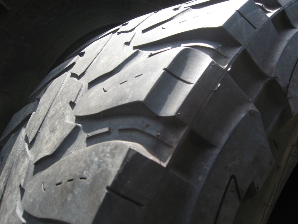 Close-up of aggressive tire tread pattern