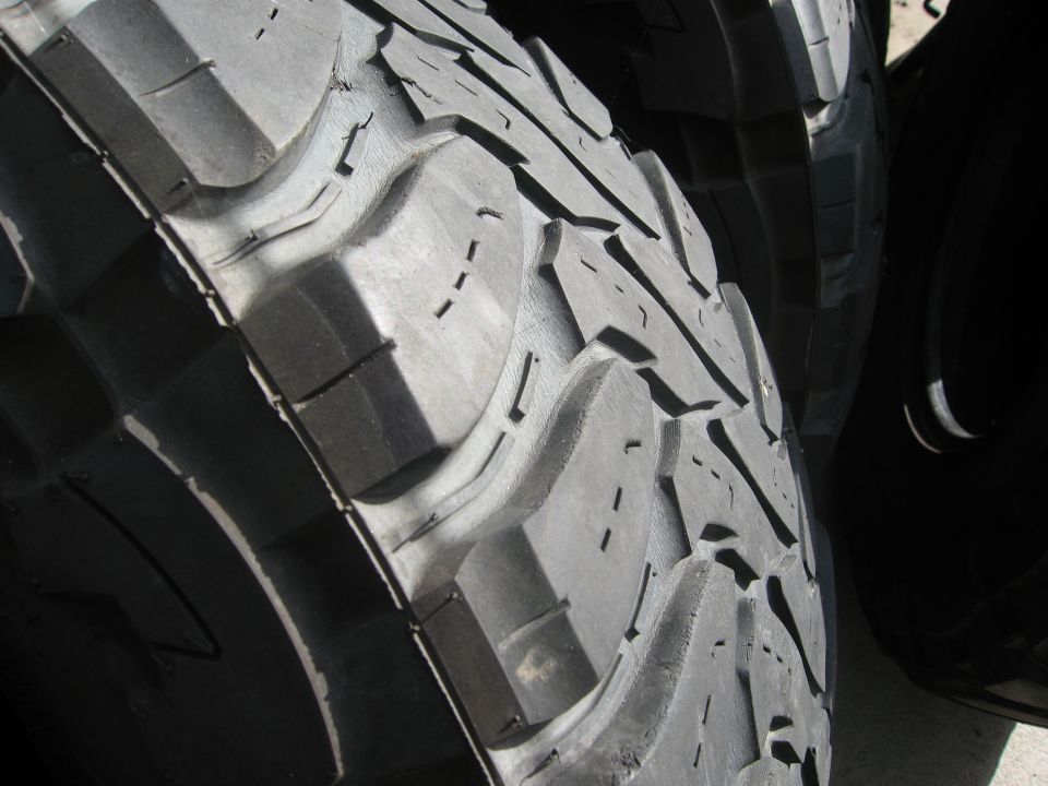 Close-up of aggressive off-road tire tread pattern
