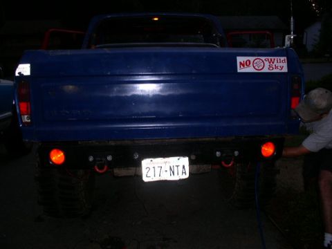 1979 Ford Bronco - Rear view of a blue pickup truck with a custom bumper and tow hooks, displaying license plate 217-NTA.
