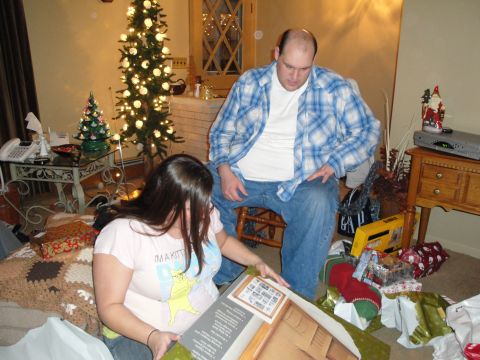2000 Ford Crown Victoria - Christmas morning gift opening scene with a decorated tree and presents scattered around.