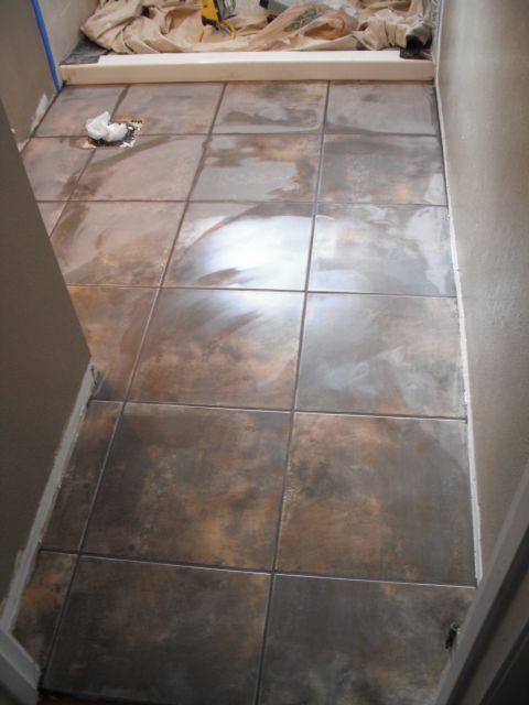 1991 Ford Bronco - Tiled floor installation in progress, with tools and protective coverings visible.
