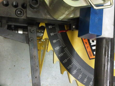 1996 Ford Bronco - A close-up shows the angle gauge on a tube bending machine, with markings indicating degrees.