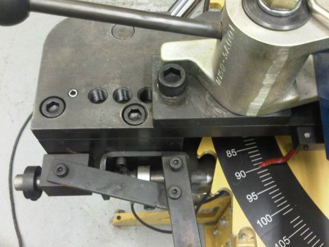 1996 Ford Bronco - Close-up of a pipe bender showing degree markings, indicating precise angle control for bending operations.