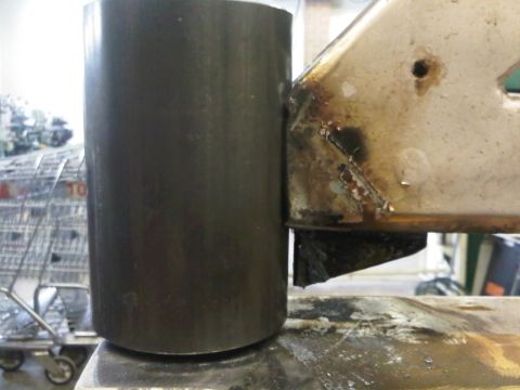 1996 Ford Bronco - Close-up view of a metal part with visible welds and a cylindrical component.