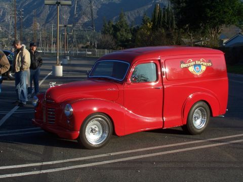 1990 Ford Bronco - This red panel van has a 'British Express' logo and custom wheels.