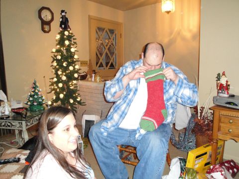 2000 Ford Crown Victoria - A festive scene unfolds with a decorated Christmas tree and people preparing for the holidays.