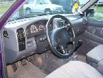 1988 Suzuki Samurai - Interior view of a purple vehicle, with a white vehicle visible in the background.