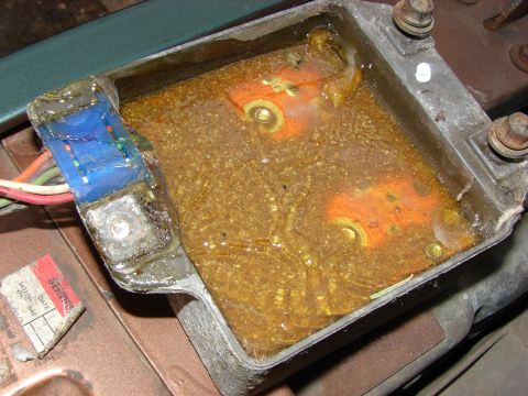 1979 Jeep CJ7 - This ignition control module appears to be filled with a liquid, obscuring some of its internal components.