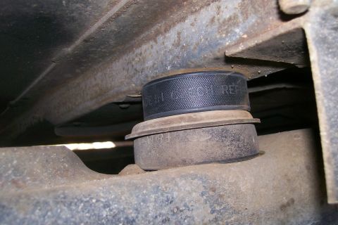 1992 Ford C-350 (Centurion Conversions) - Body lift block installed on vehicle frame, showing part details.