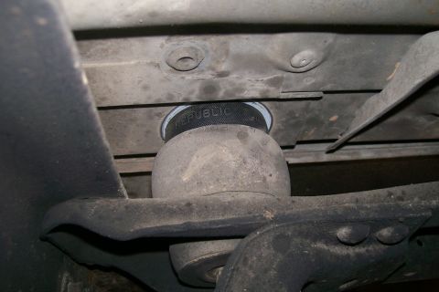 1992 Ford C-350 (Centurion Conversions) - Underside view of a vehicle's suspension system, showing an air spring assembly.