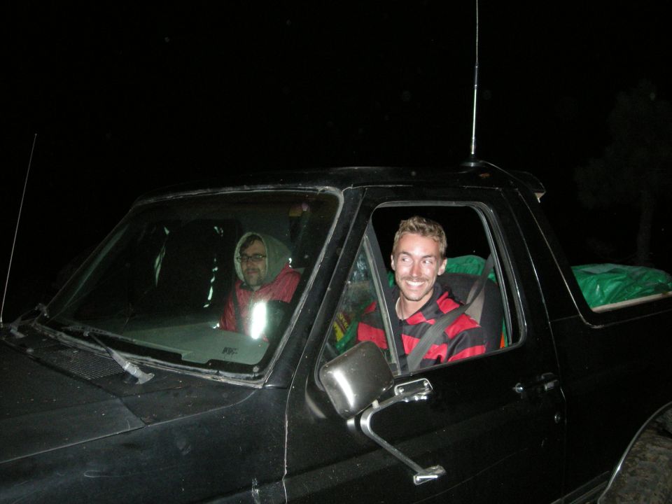 1991 Ford Bronco interior with two men, driver smiling, passenger looking forward