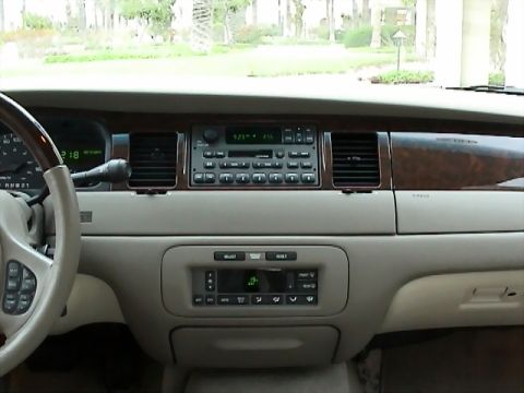 2002 Lincoln Town Car - Interior view of a 2002 Lincoln Town Car dashboard, showing the center console and steering wheel.