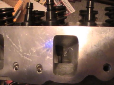1971 Ford Mustang - Close-up view of an engine cylinder head, showing valves and springs.
