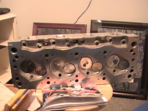 1971 Ford Mustang - Aluminum engine cylinder head with 'BULLX' cast into it is shown.