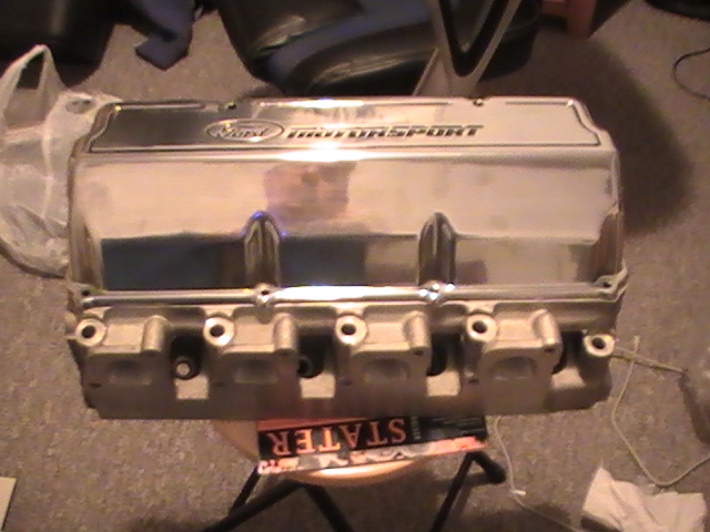 Chrome Ford Motorsport valve cover on a stand