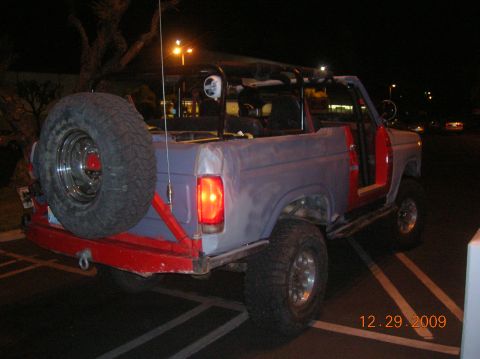 1985 Ford Bronco - This Ford Bronco appears to be undergoing restoration, with primer visible on its body panels and doors removed.