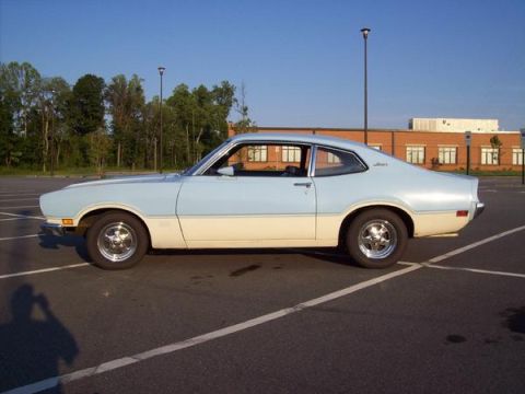 1973 Ford Maverick - This two-tone 1973 Ford Maverick coupe is seen from the side in a parking lot.
