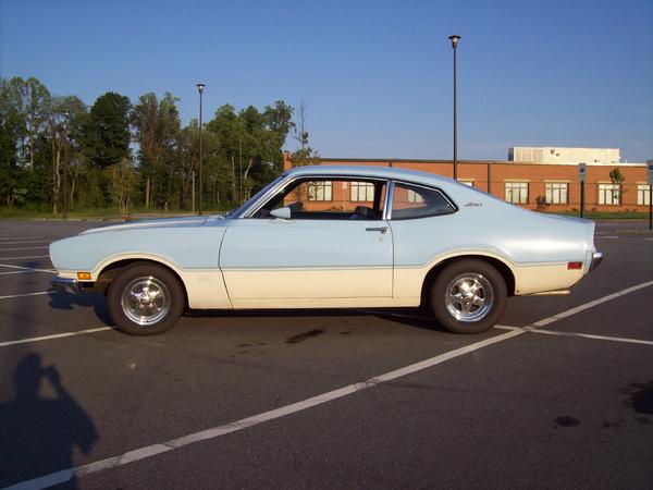 Side view of a 1973 Ford Maverick coupe, two-tone light blue and cream