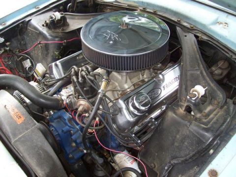 1973 Ford Maverick - The engine bay shows a V8 motor with a large air filter and chrome valve covers.