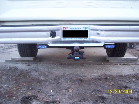 1978 Ford Bronco - Pickup truck rear bumper with hitch and blue trailer lights, dated 12/29/2009.