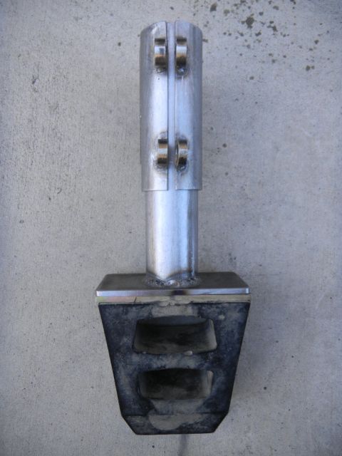 1997 Ford Ranger - Custom exhaust tip with a metal upper section and a rubber isolator base, photographed against a concrete surface.