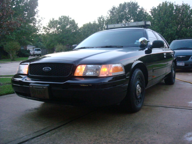 Black 2003 Ford Crown Victoria police car, 3q-front view