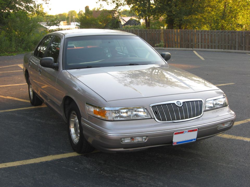 Tan 1995 Mercury Grand Marquis parked in a lot