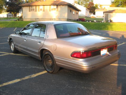 1995 Mercury Grand Marquis - Rear view of a 1995 Mercury Grand Marquis sedan parked outdoors.
