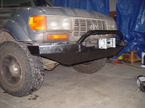1993 Ford Bronco - The grille and headlight design indicate this is a Toyota Land Cruiser, not a 1993 Ford Bronco.