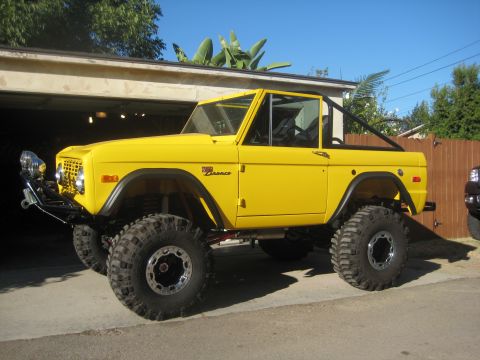 1970 Ford Bronco - This lifted 1970 Ford Bronco features oversized tires and a roll cage, ready for off-road adventures.