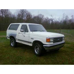 1989 Ford Bronco - White 1989 Ford Bronco with a three-quarter front view, parked outdoors.