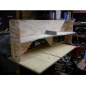 1989 Ford Bronco - A custom-built wooden shelf unit designed for interior use, likely for storage or display.